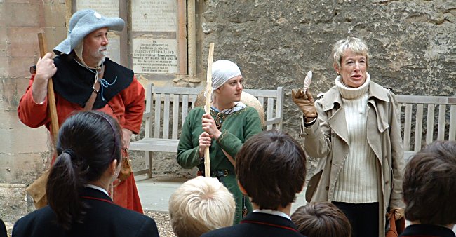 Pilgrim re-enactors and Dr. Carol Rawcliffe speak to pupils